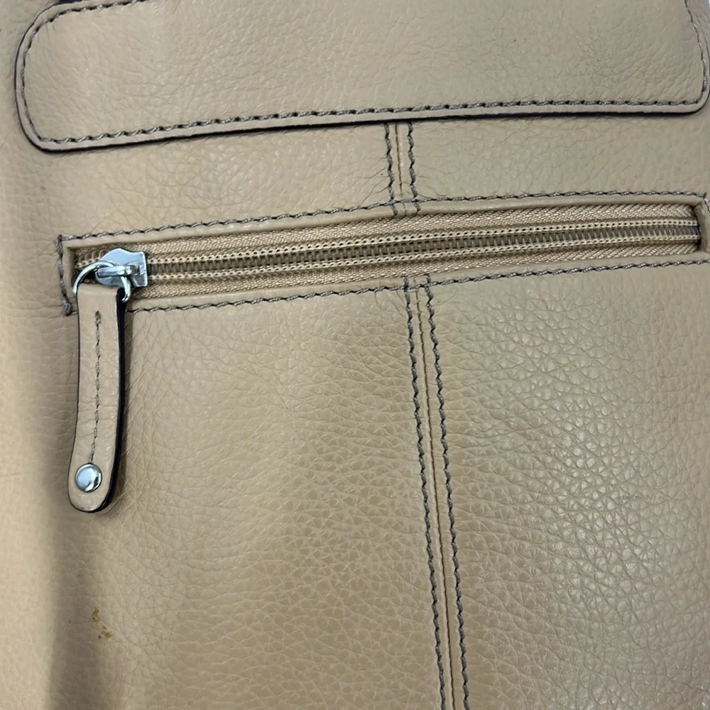 Clark’s vintage leather convertible, backpack shoulder bag.